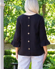 EQUINOX-  Smart casual button back feature top.  Black