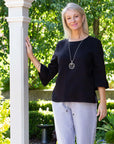 EQUINOX-  Smart casual button back feature top.  Black