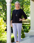 EQUINOX-  Smart casual button back feature top.  Black